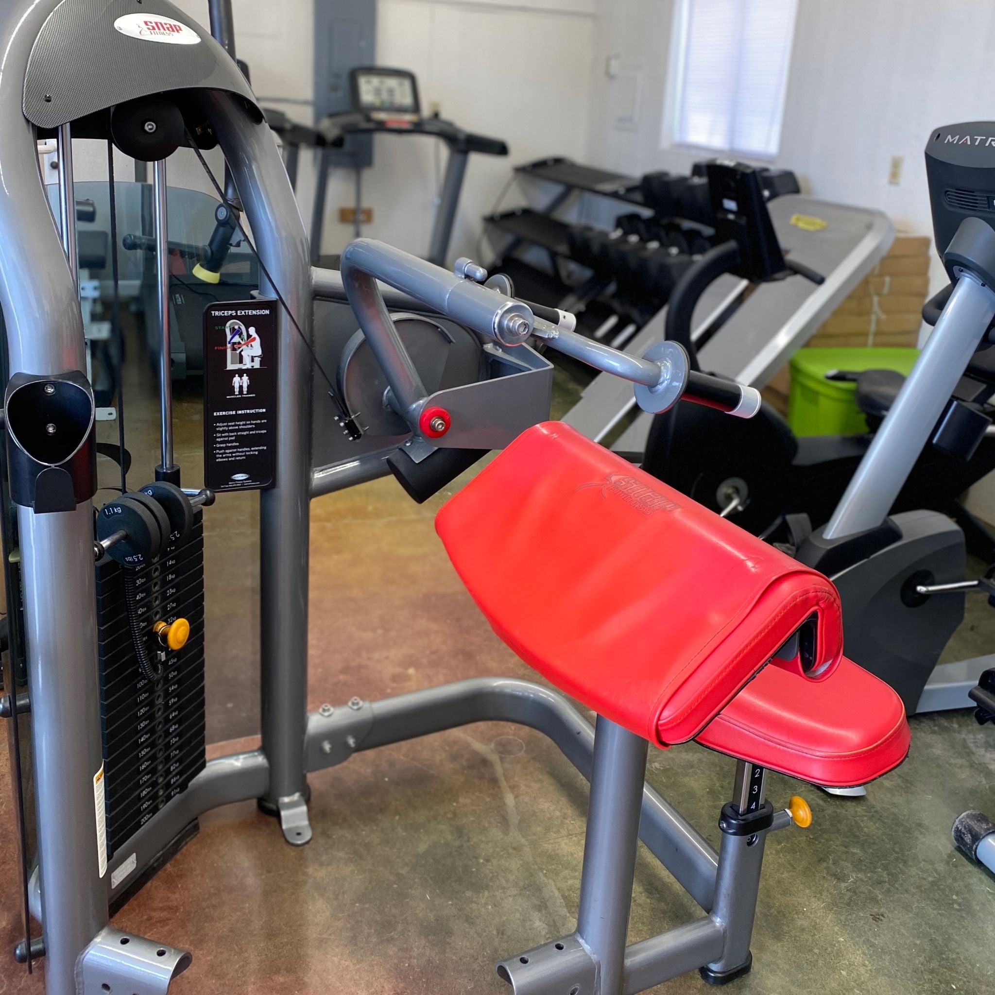 Left-hand view of the Matrix G3 Tricep Extension in Warehouse, Red seating