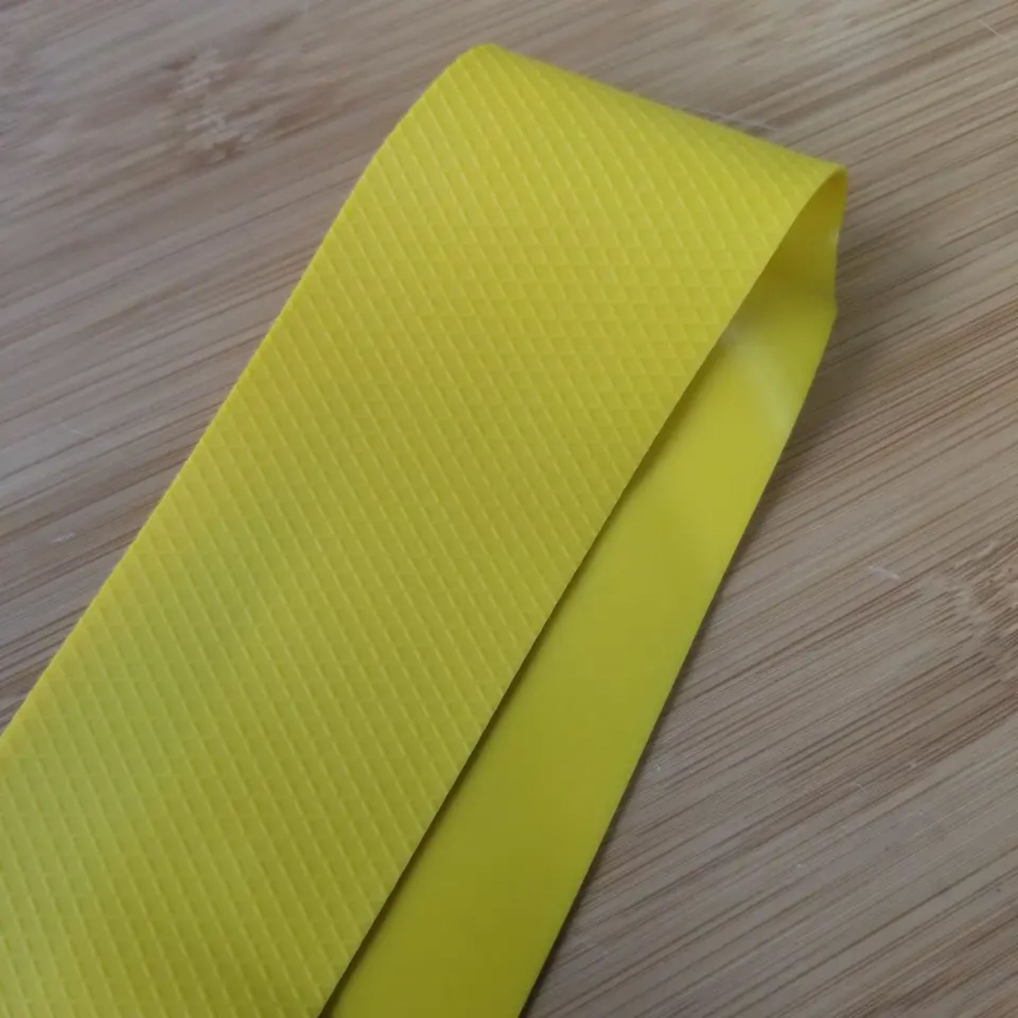 Closeup of the Fold on the Yellow 3D Grip Latex Resistance Band Set