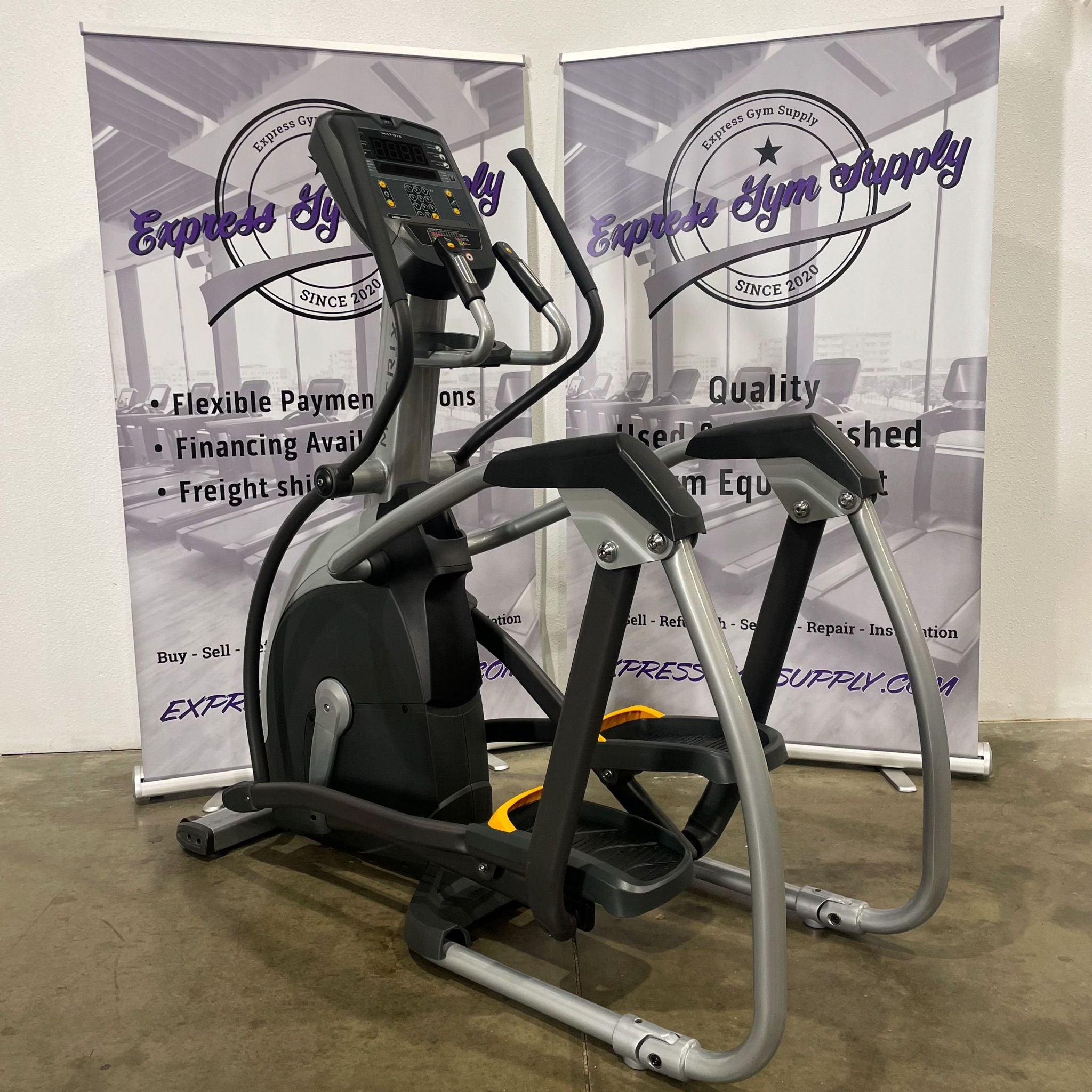 Front left view of the Matrix E1x Elliptical in Warehouse